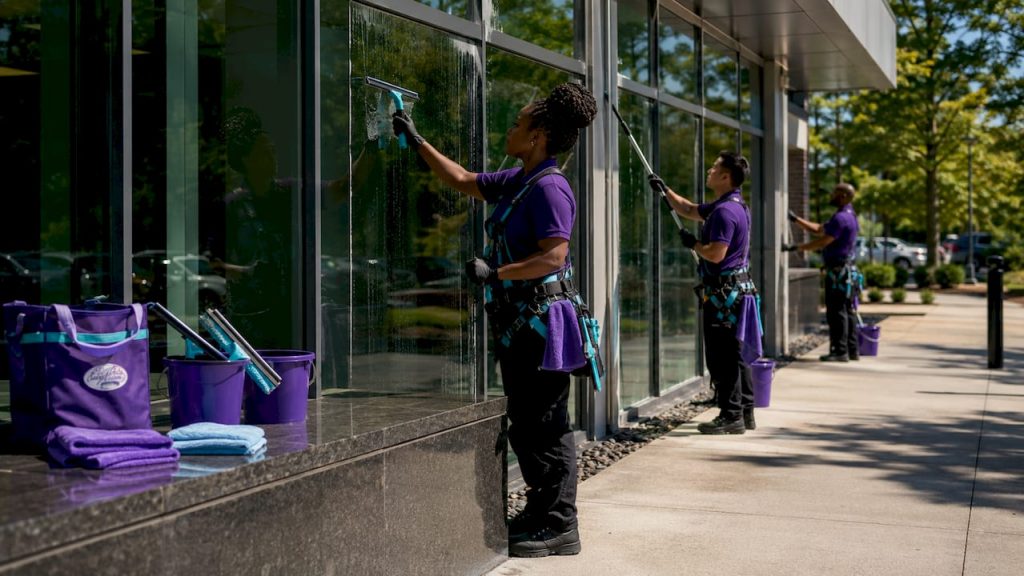 Commercial window cleaning crew working outdoors