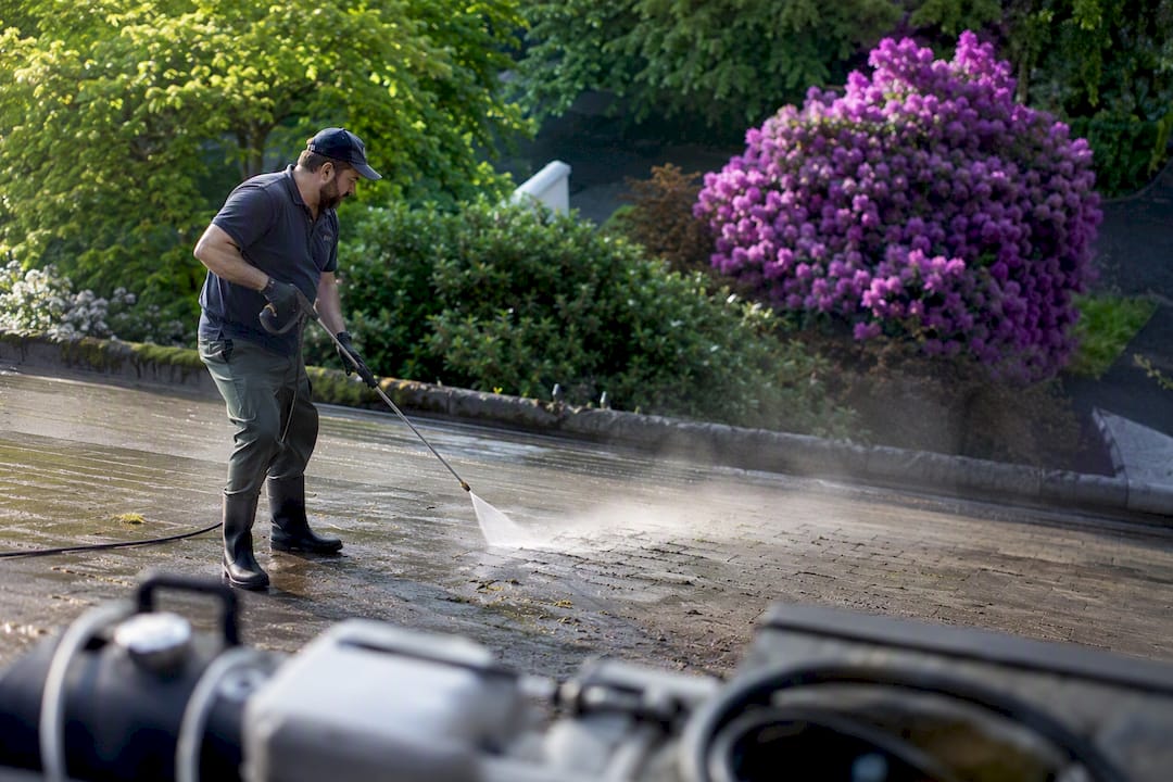 Soft washing algae removal on roof
