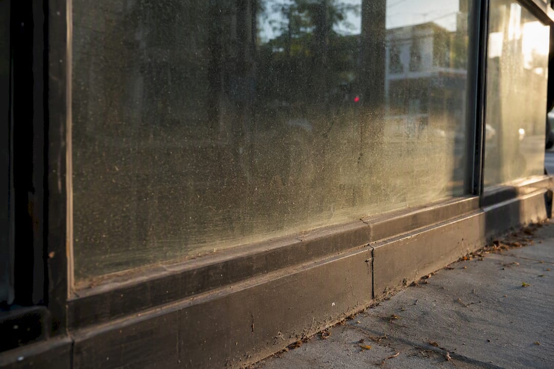 Dirty storefront windows with smudges and streaks